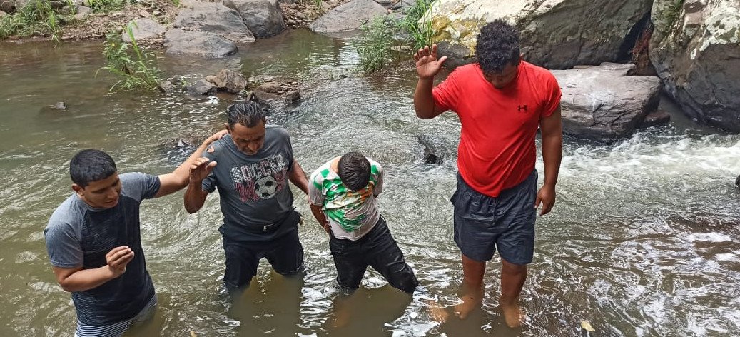 EN4C locals baptizing in the river